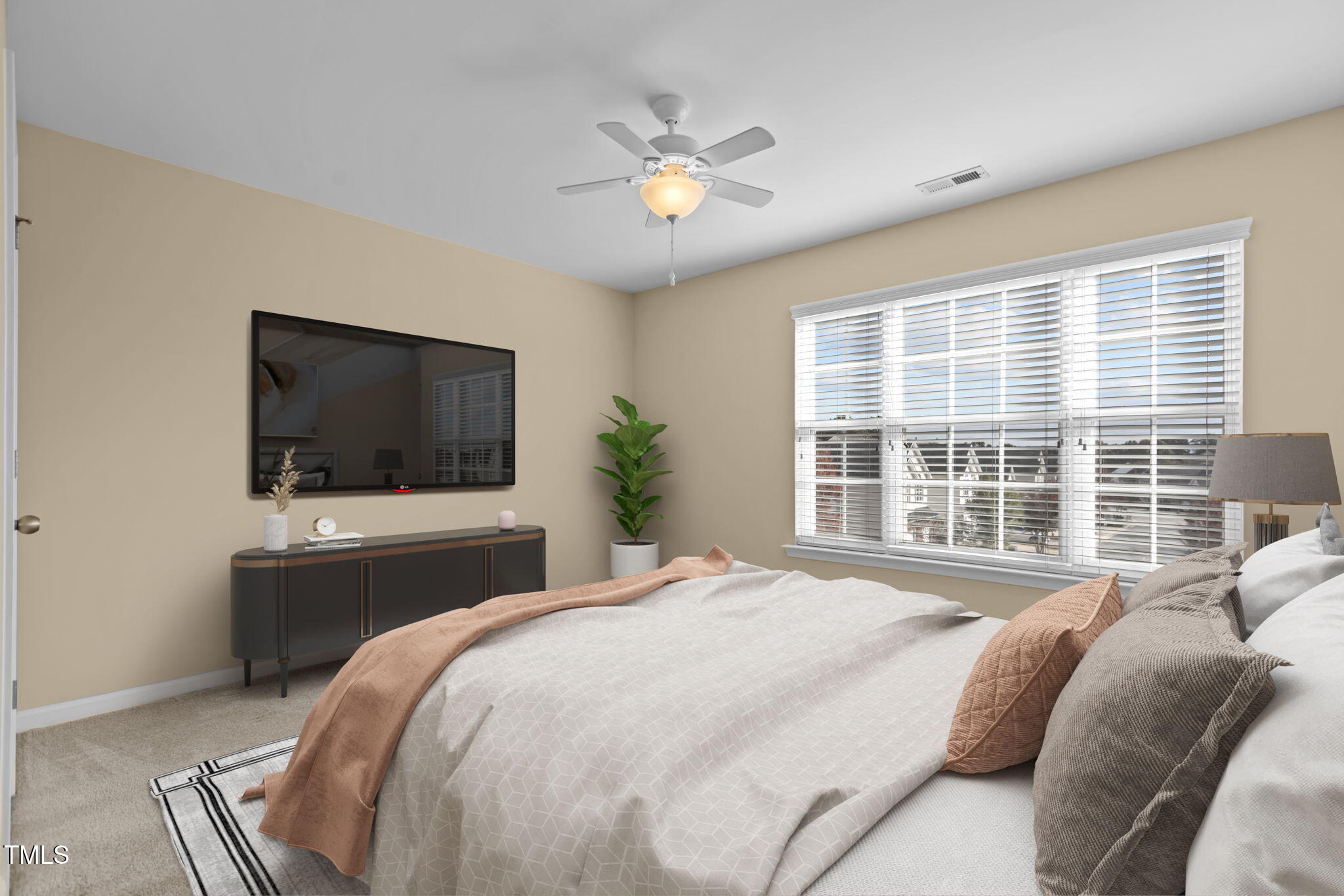 2160 Persimmon Ridge Drive Raleigh, NC 27604 - Photo 5 of 16 a bedroom with a bed and a flat screen tv
