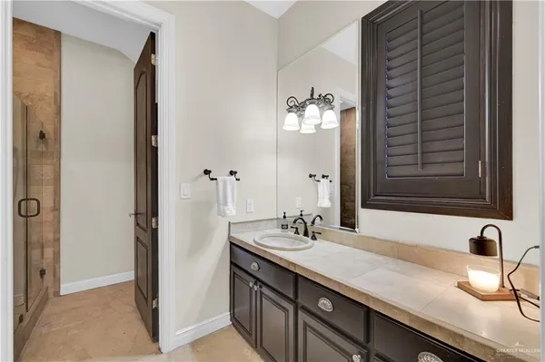 a bathroom with a double vanity sink and a mirror