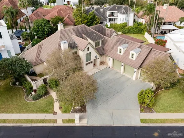 an aerial view of a house with outdoor space