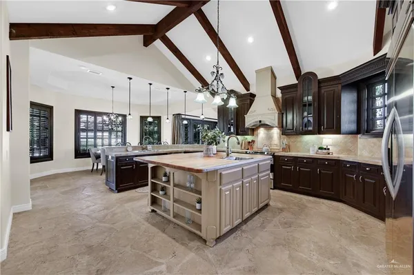 a kitchen with a stove and a refrigerator