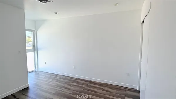 a view of small space with wooden floor