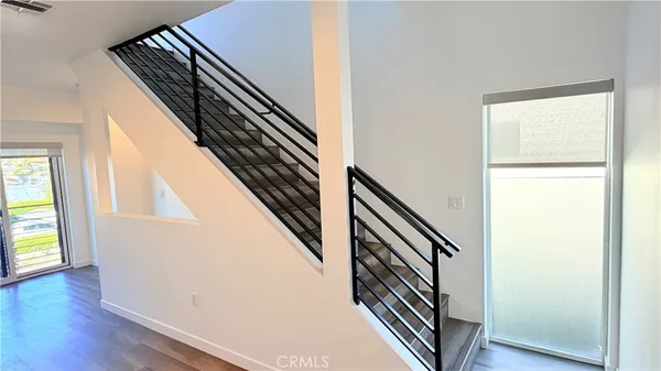 an entryway with wooden floor