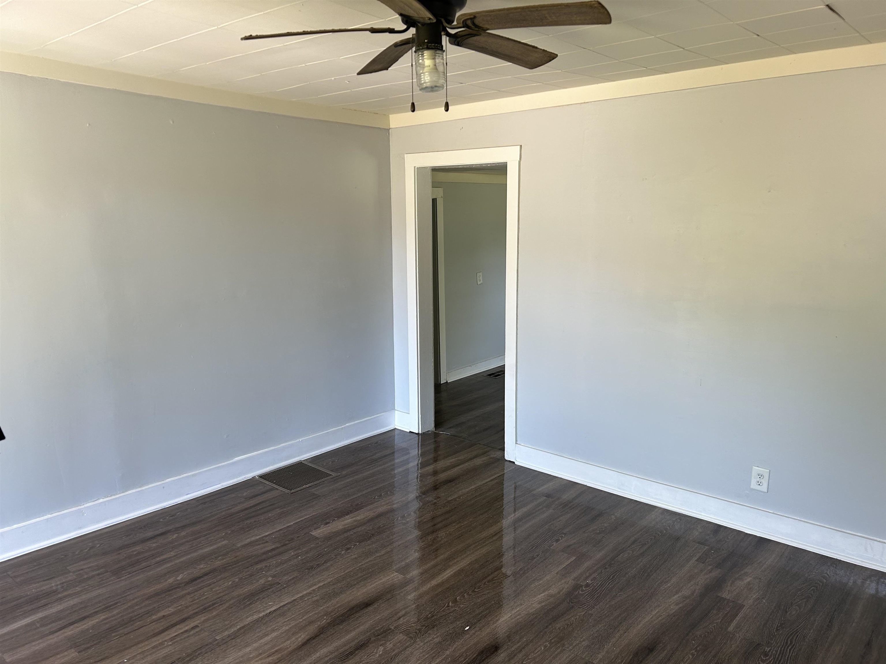 3030 Alta Road Memphis, TN 38109 - Photo 3 of 6 a view of an empty room with wooden floor
