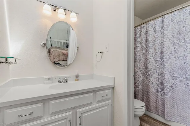 a bathroom with a sink and mirror