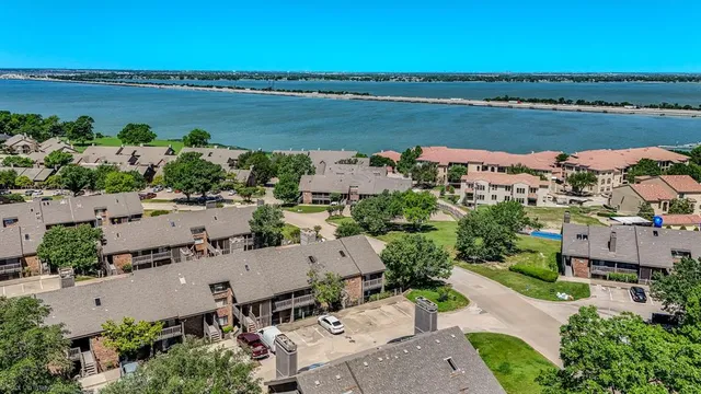 an aerial view of a city with lake view