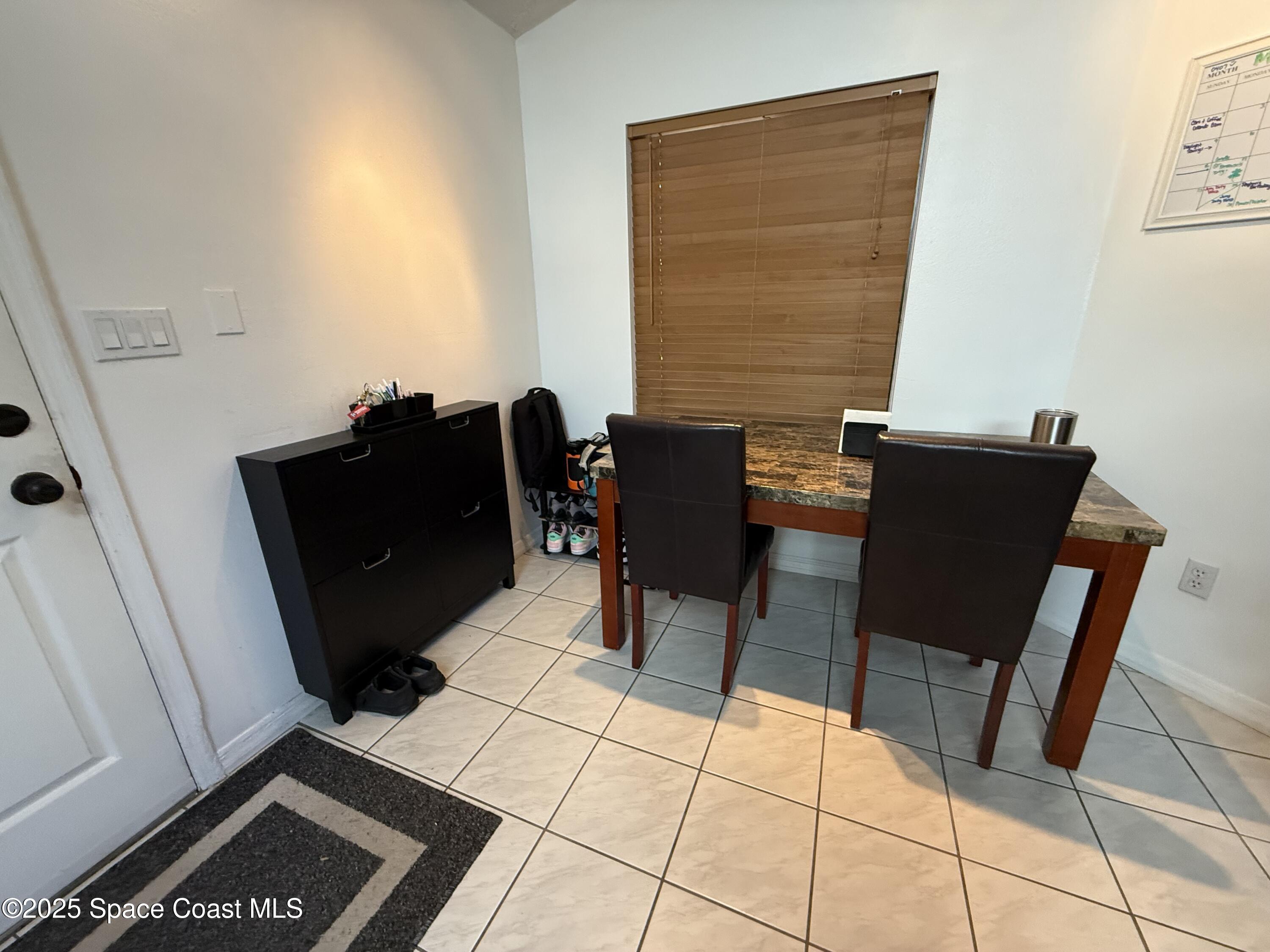 3960 Raney Road Titusville, FL 32780 - Photo 14 of 33 a living room with furniture and a window