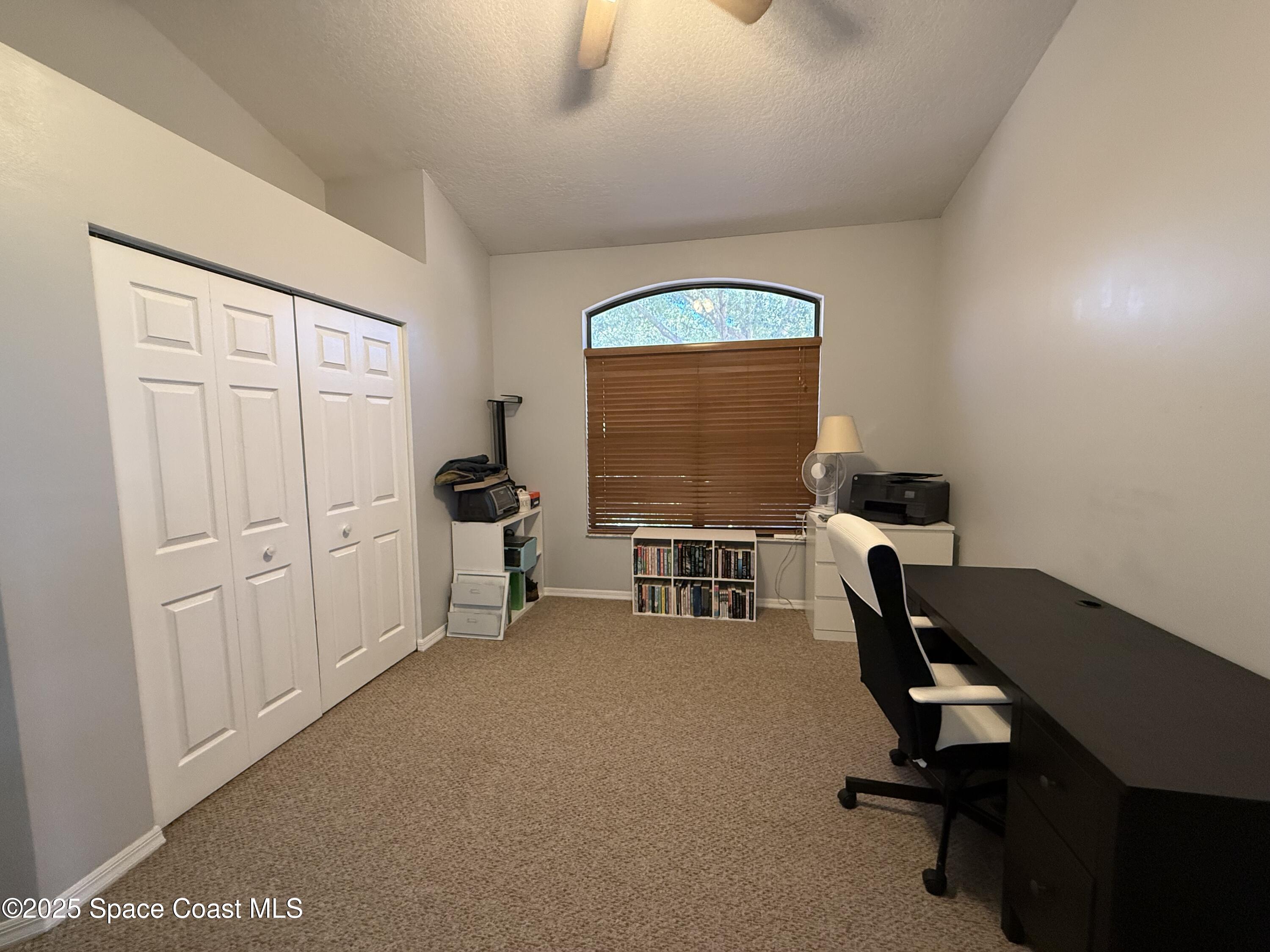 3960 Raney Road Titusville, FL 32780 - Photo 16 of 33 a workspace with furniture and a window