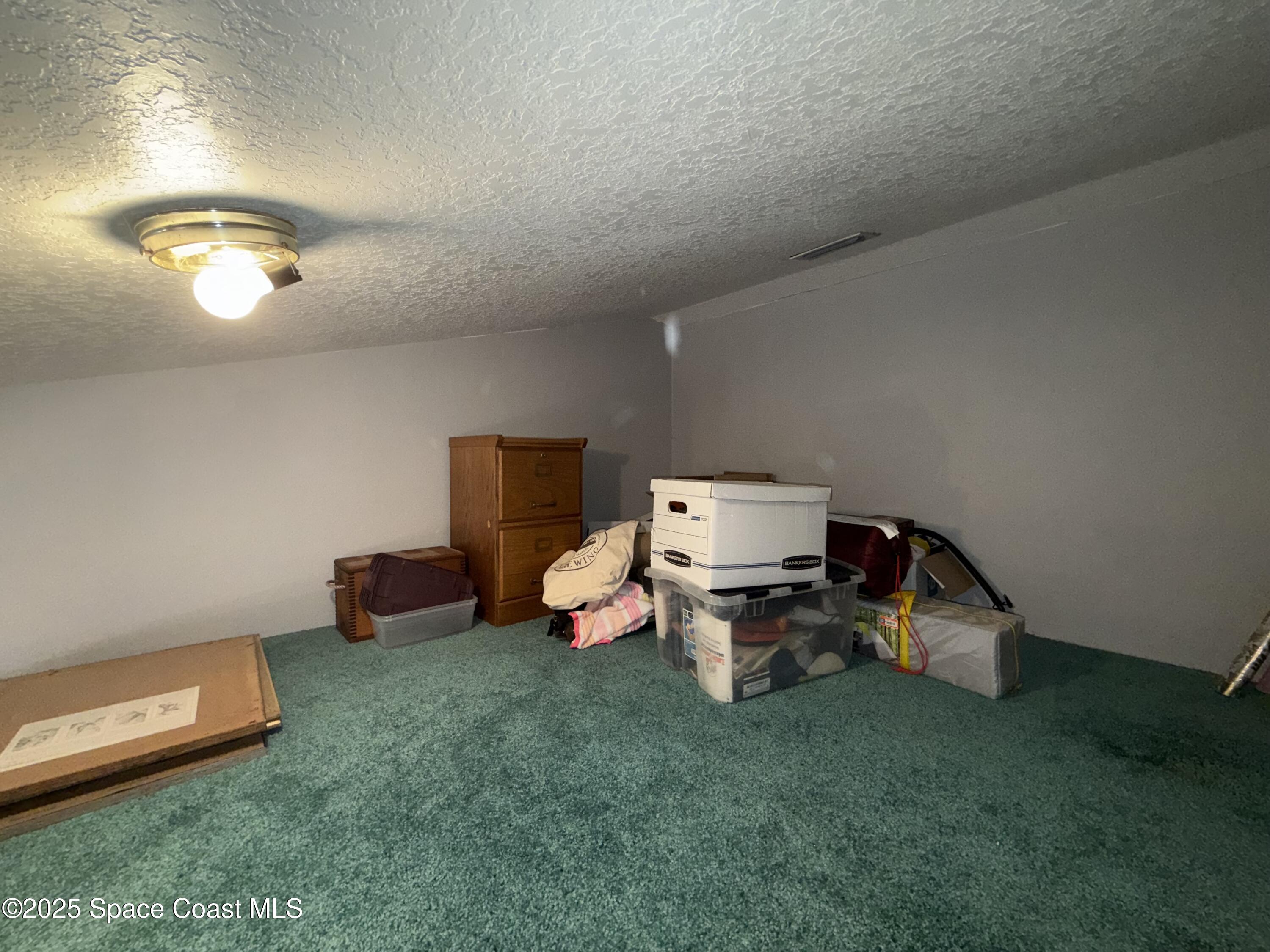 3960 Raney Road Titusville, FL 32780 - Photo 21 of 33 a view of a room with a chair and toys