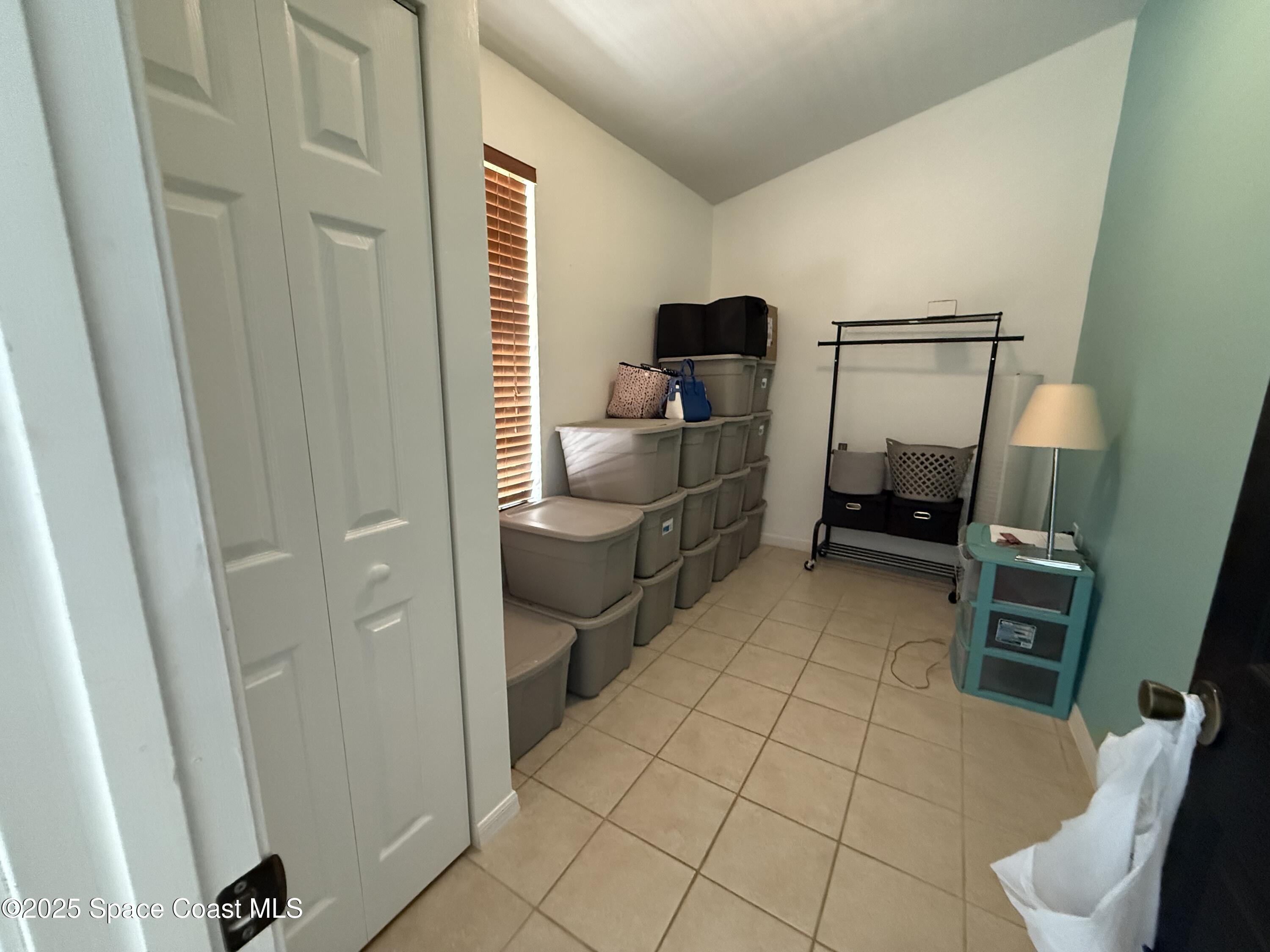 3960 Raney Road Titusville, FL 32780 - Photo 24 of 33 a room with furniture and a window