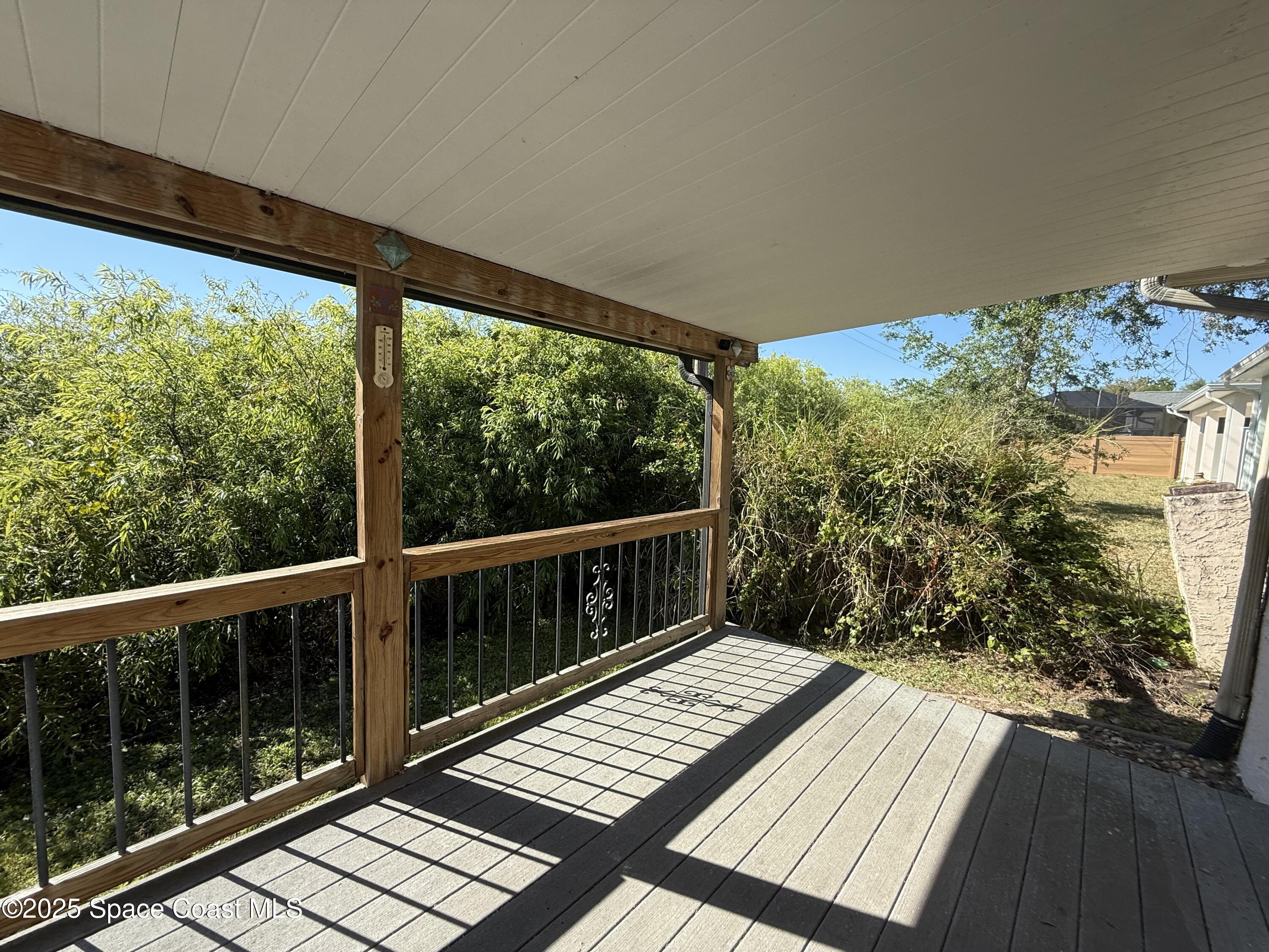 3960 Raney Road Titusville, FL 32780 - Photo 26 of 33 a view of balcony with wooden floor