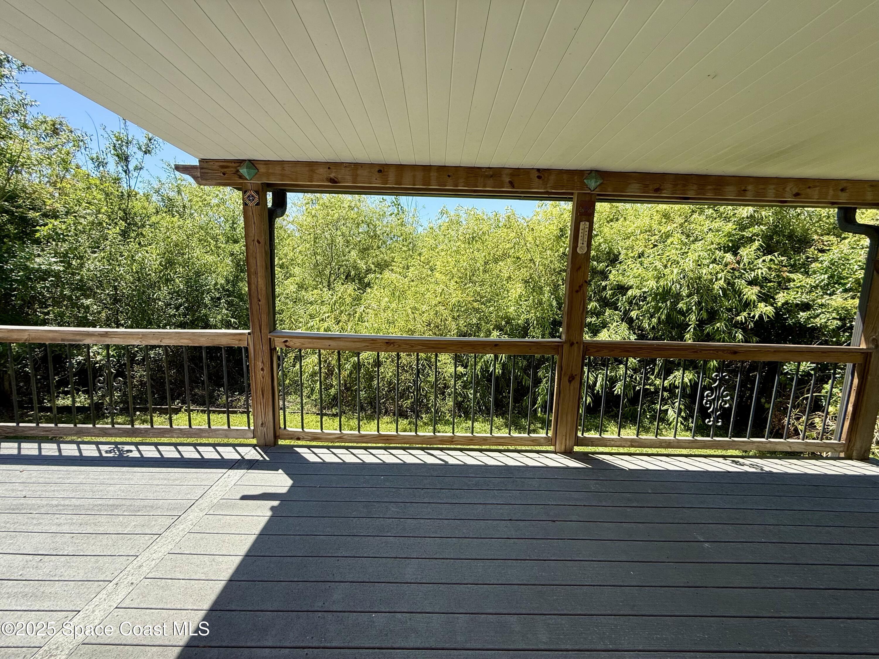 3960 Raney Road Titusville, FL 32780 - Photo 28 of 33 a view of balcony with mountain view and wooden floor