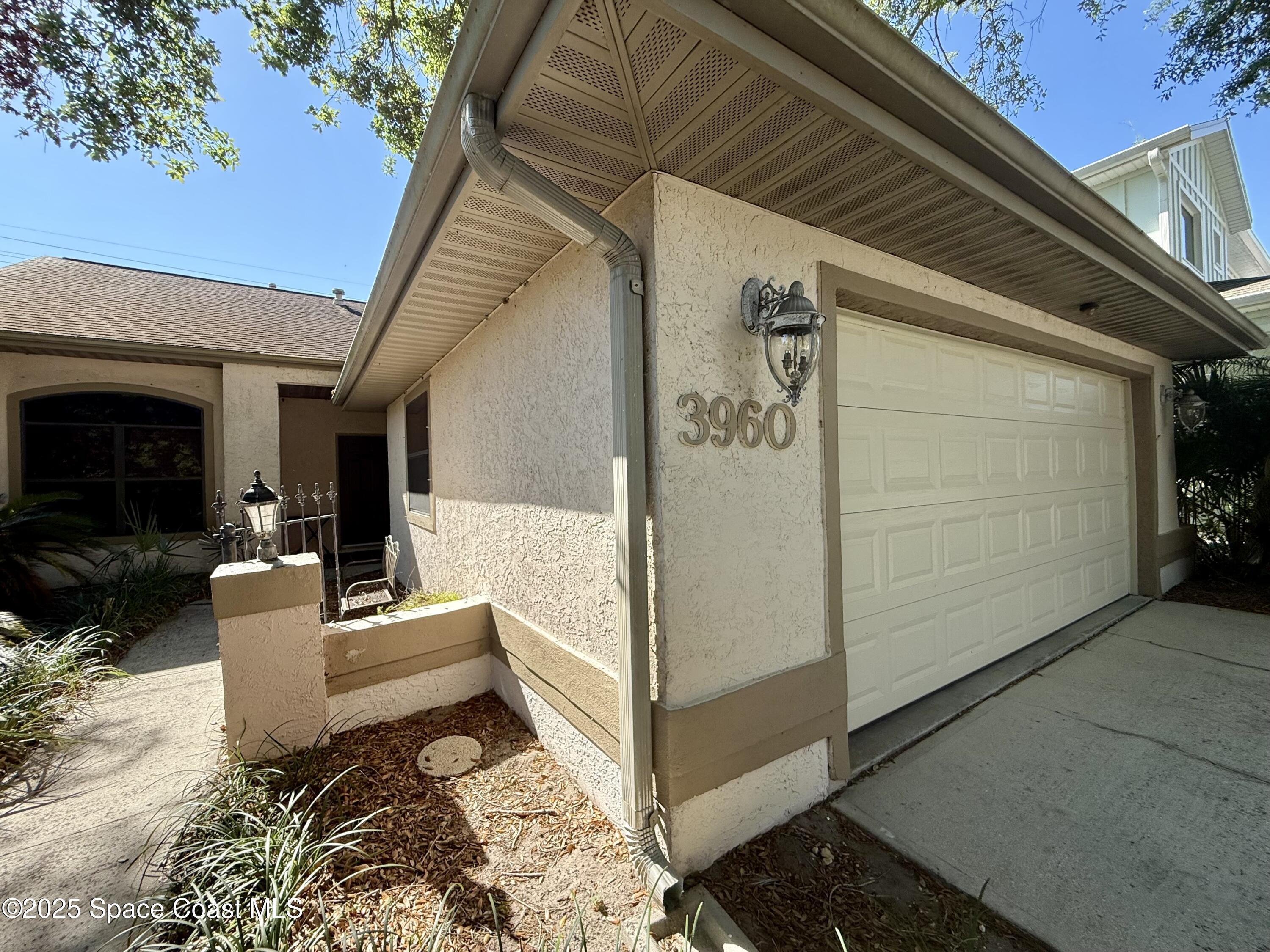 3960 Raney Road Titusville, FL 32780 - Photo 3 of 33 a view of a porch with furniture