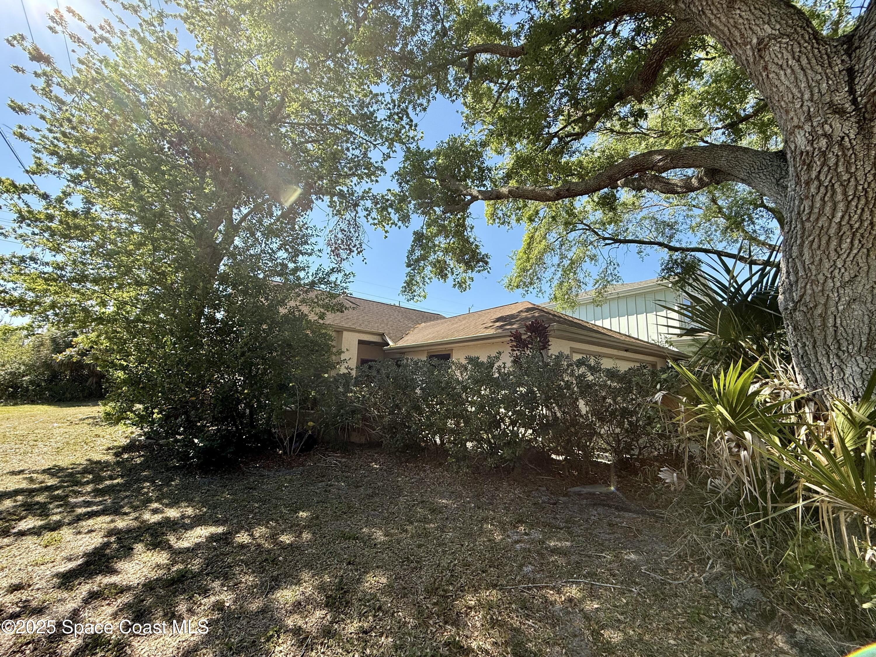 3960 Raney Road Titusville, FL 32780 - Photo 7 of 33 a view of a house with a tree