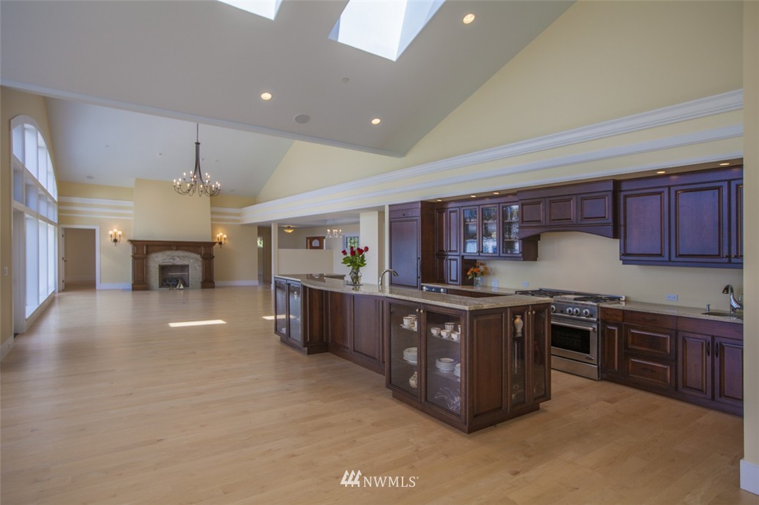 530 Bayside Road Bellingham, WA 98225 - Photo 12 of 25 a kitchen with stainless steel appliances granite countertop a stove a sink dishwasher and a refrigerator