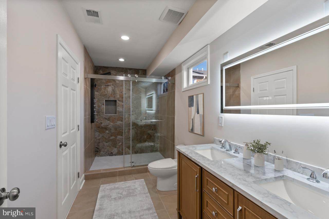 919 Stiles Street Baltimore, MD 21202 - Photo 12 of 35 Modern bathroom with elegant finishes.