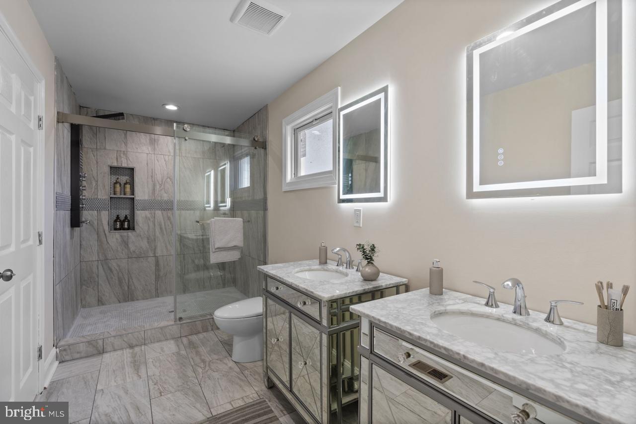 919 Stiles Street Baltimore, MD 21202 - Photo 19 of 35 Sleek modern bathroom with elegant finishes.