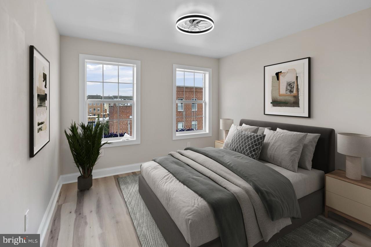 919 Stiles Street Baltimore, MD 21202 - Photo 20 of 35 Serene bedroom with modern elegance.