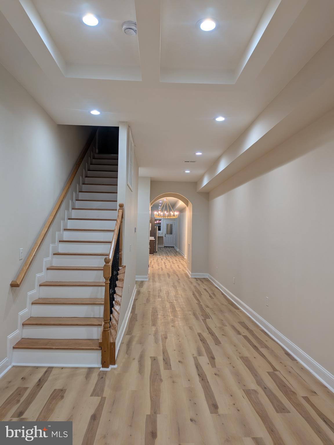 919 Stiles Street Baltimore, MD 21202 - Photo 28 of 35 Inviting hallway with elegant staircase.