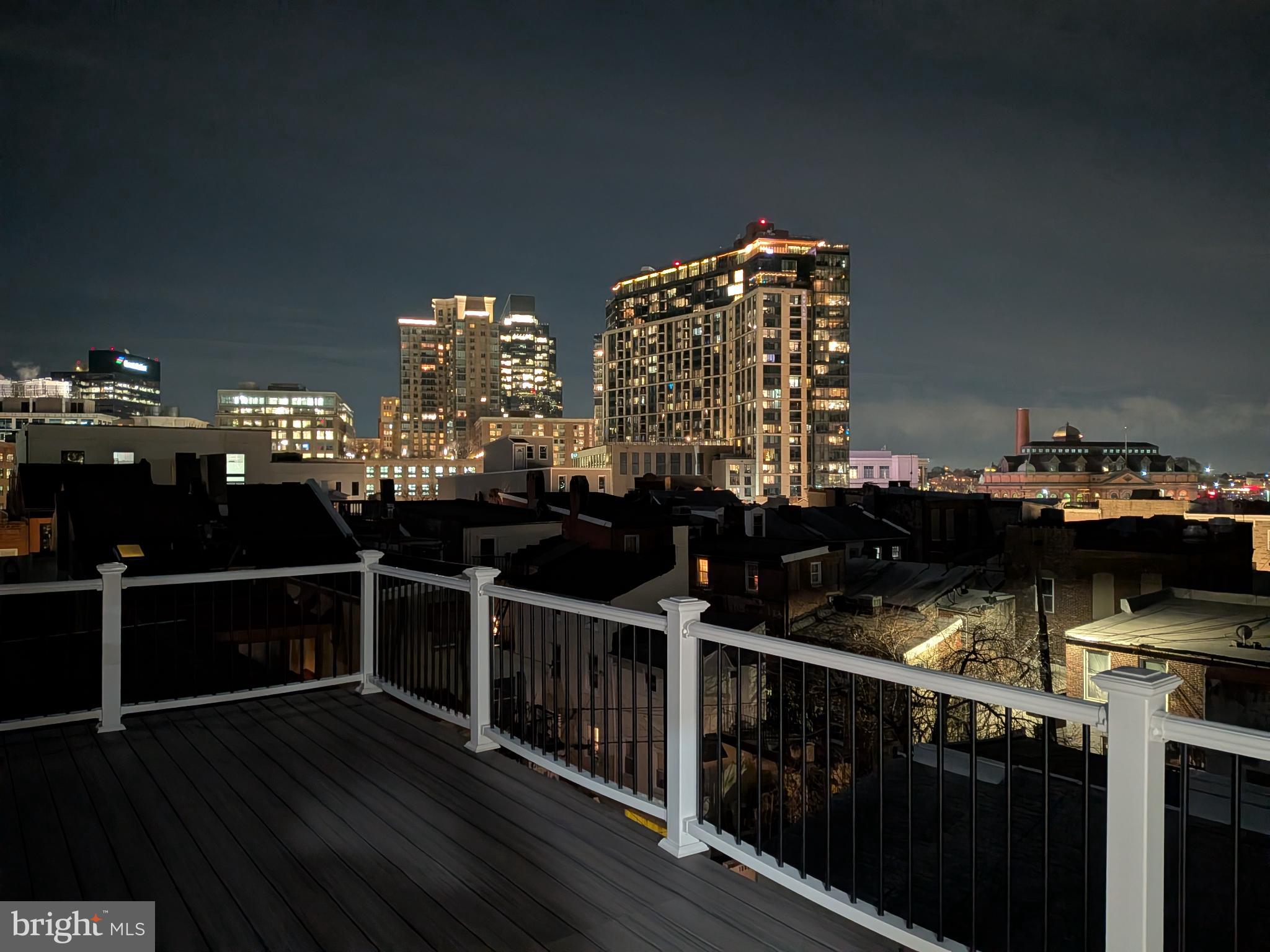 919 Stiles Street Baltimore, MD 21202 - Photo 4 of 35 City skyline illuminated at night.