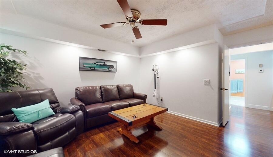 128 Cape Pointe Circle Jupiter, FL 33477 - Photo 16 of 42 a living room with furniture and a wooden floor