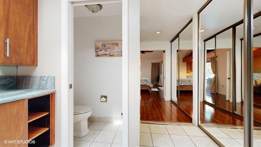 128 Cape Pointe Circle Jupiter, FL 33477 - Photo 22 of 42 a bathroom with a toilet a sink and glass door