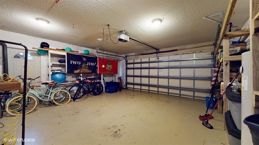 128 Cape Pointe Circle Jupiter, FL 33477 - Photo 28 of 42 a view of a room with gym equipment