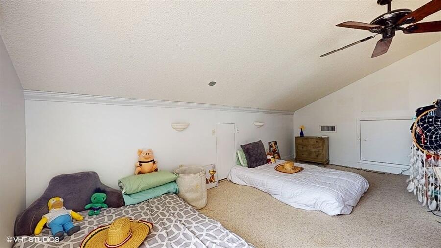 128 Cape Pointe Circle Jupiter, FL 33477 - Photo 34 of 42 a bedroom with furniture and a couch