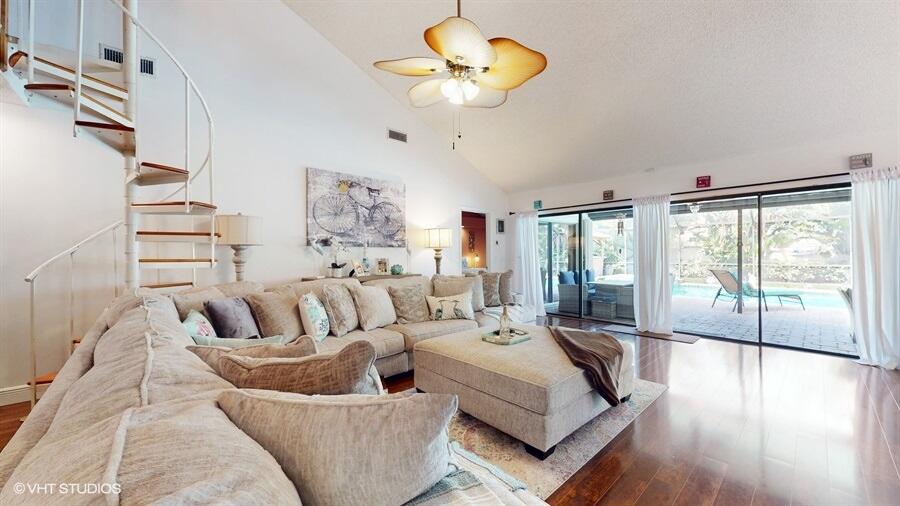 128 Cape Pointe Circle Jupiter, FL 33477 - Photo 5 of 42 a living room with furniture and a large window