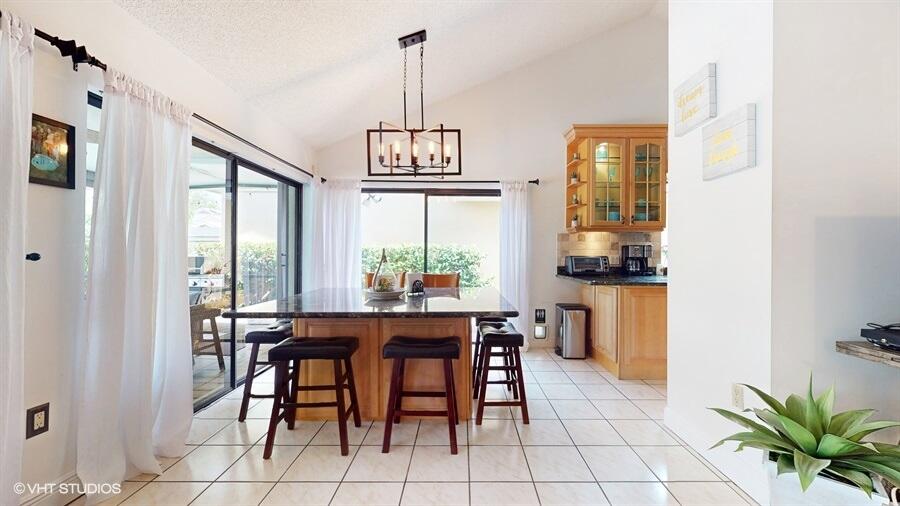 128 Cape Pointe Circle Jupiter, FL 33477 - Photo 9 of 42 a view of a dining room with furniture window and outside view