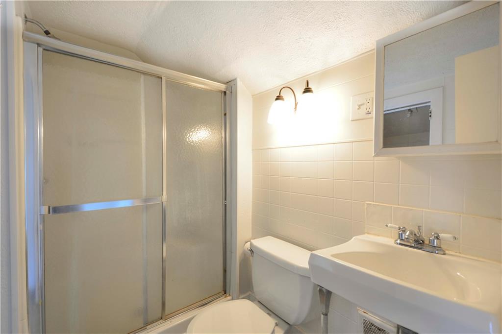 714 Main Street Coraopolis, PA 15108 - Photo 12 of 13 a bathroom with a sink toilet and shower