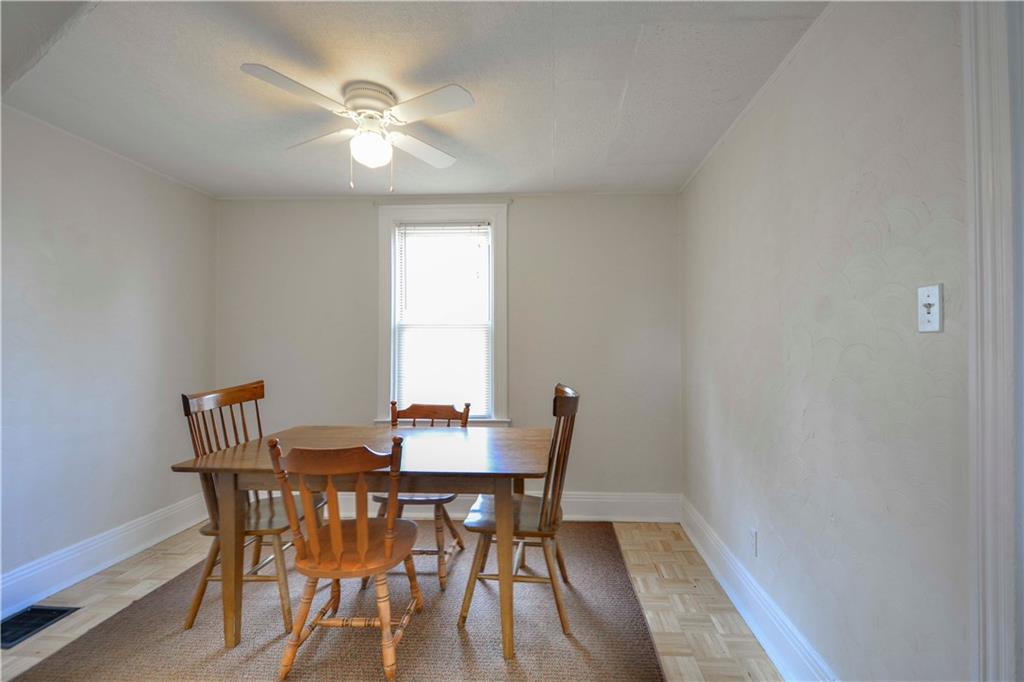 714 Main Street Coraopolis, PA 15108 - Photo 8 of 13 a view of a dining room with furniture and a chandelier fan