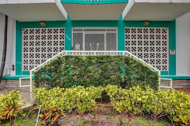 a view of a house with a flower garden