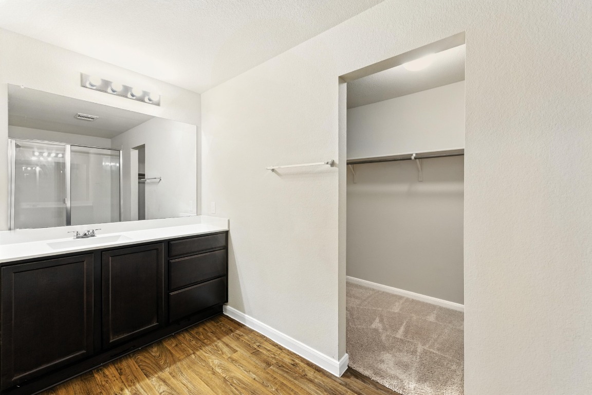 148 Alpha Kyle, TX 78640 - Photo 17 of 36 a bathroom with a sink and a mirror