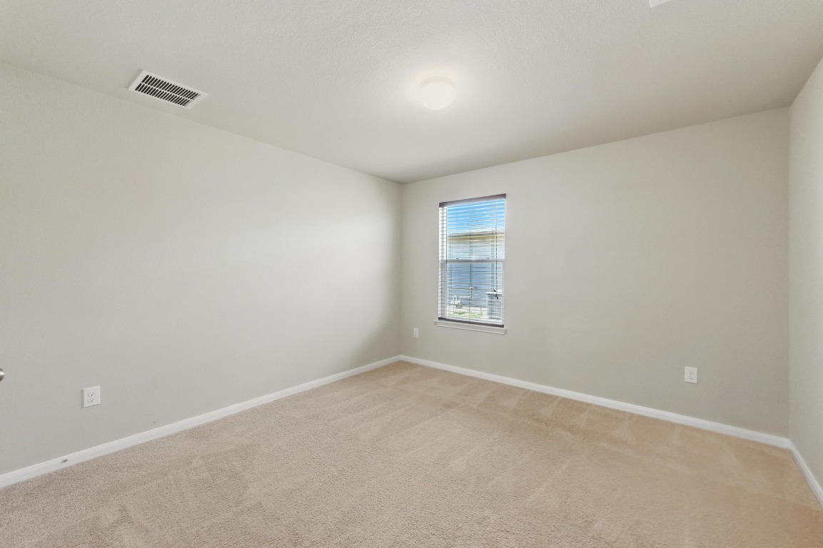 148 Alpha Kyle, TX 78640 - Photo 20 of 36 an empty room with a window