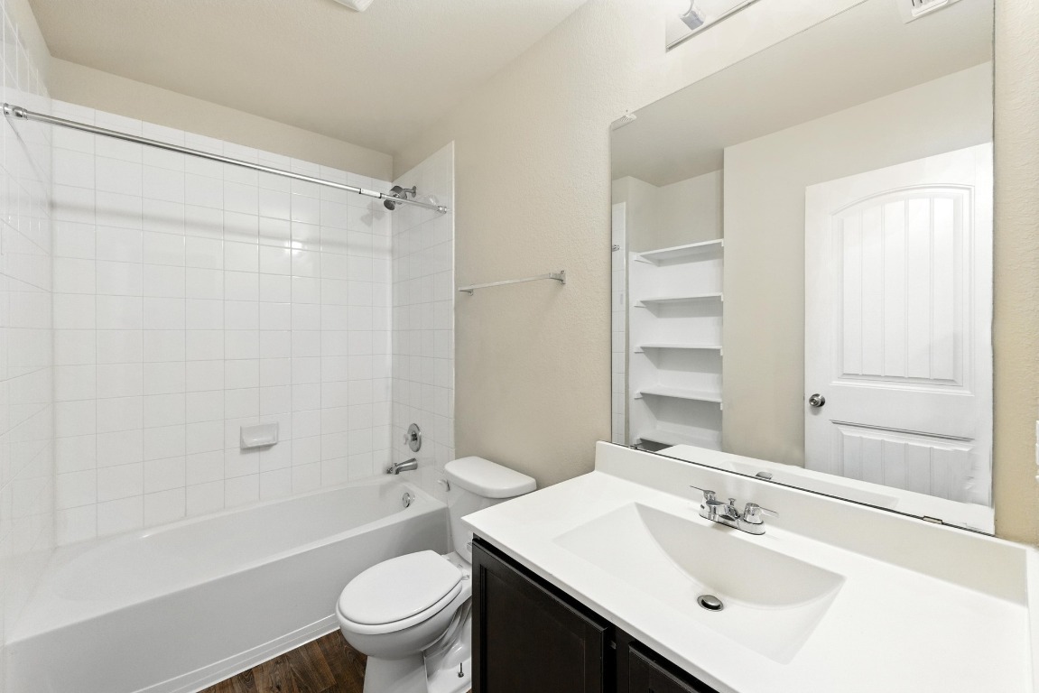 148 Alpha Kyle, TX 78640 - Photo 24 of 36 a bathroom with a sink a toilet and shower