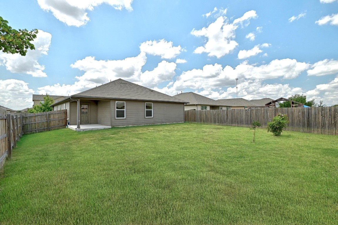 148 Alpha Kyle, TX 78640 - Photo 29 of 36 a backyard of a house with lots of green space