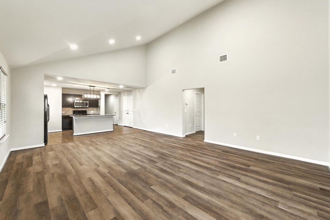 148 Alpha Kyle, TX 78640 - Photo 6 of 36 a view of an empty room and kitchen
