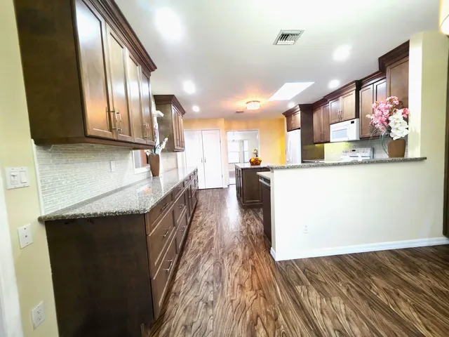 a large kitchen with a lot of counter space