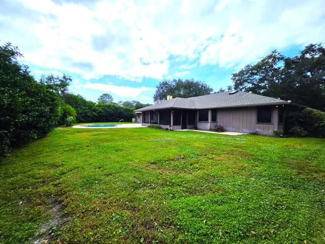 a view of a house with a swimming pool