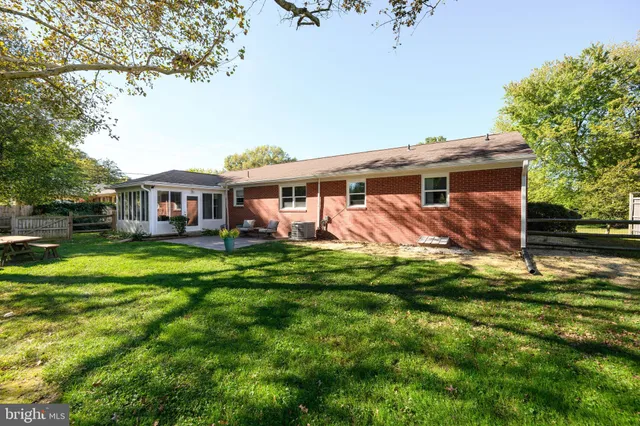 a view of a house with a yard porch and sitting area