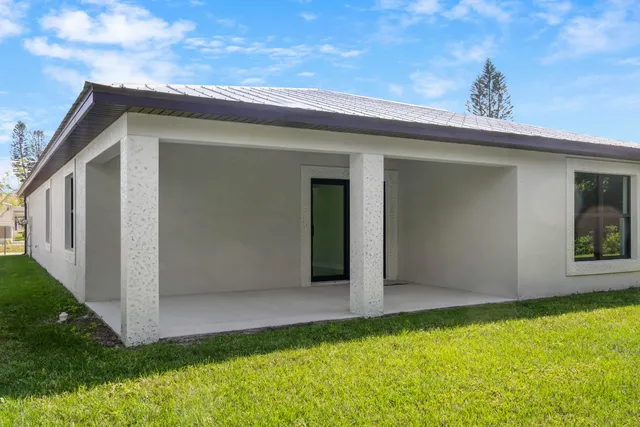 a view of an empty room with windows