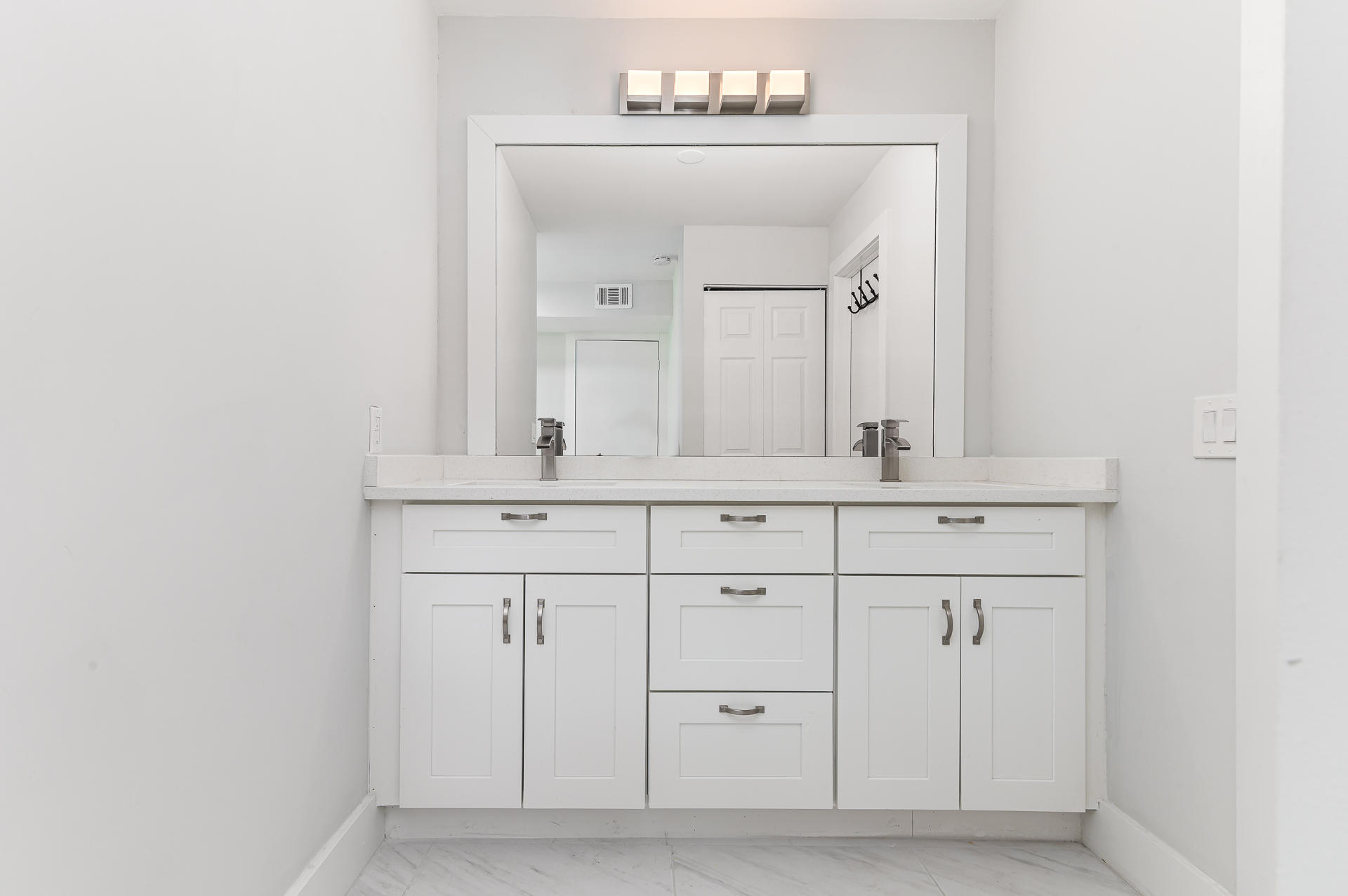 21856 Arriba Real, Unit 5E Boca Raton, FL 33433 - Photo 12 of 17 a bathroom with a sink vanity and a mirror