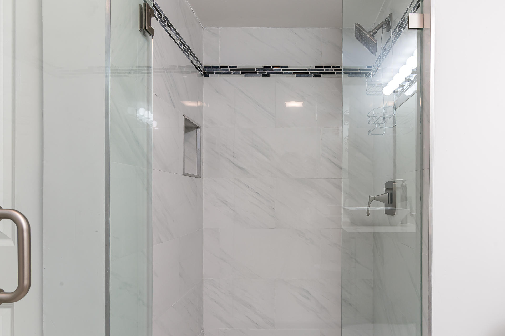 21856 Arriba Real, Unit 5E Boca Raton, FL 33433 - Photo 13 of 17 a bathroom with a glass shower door