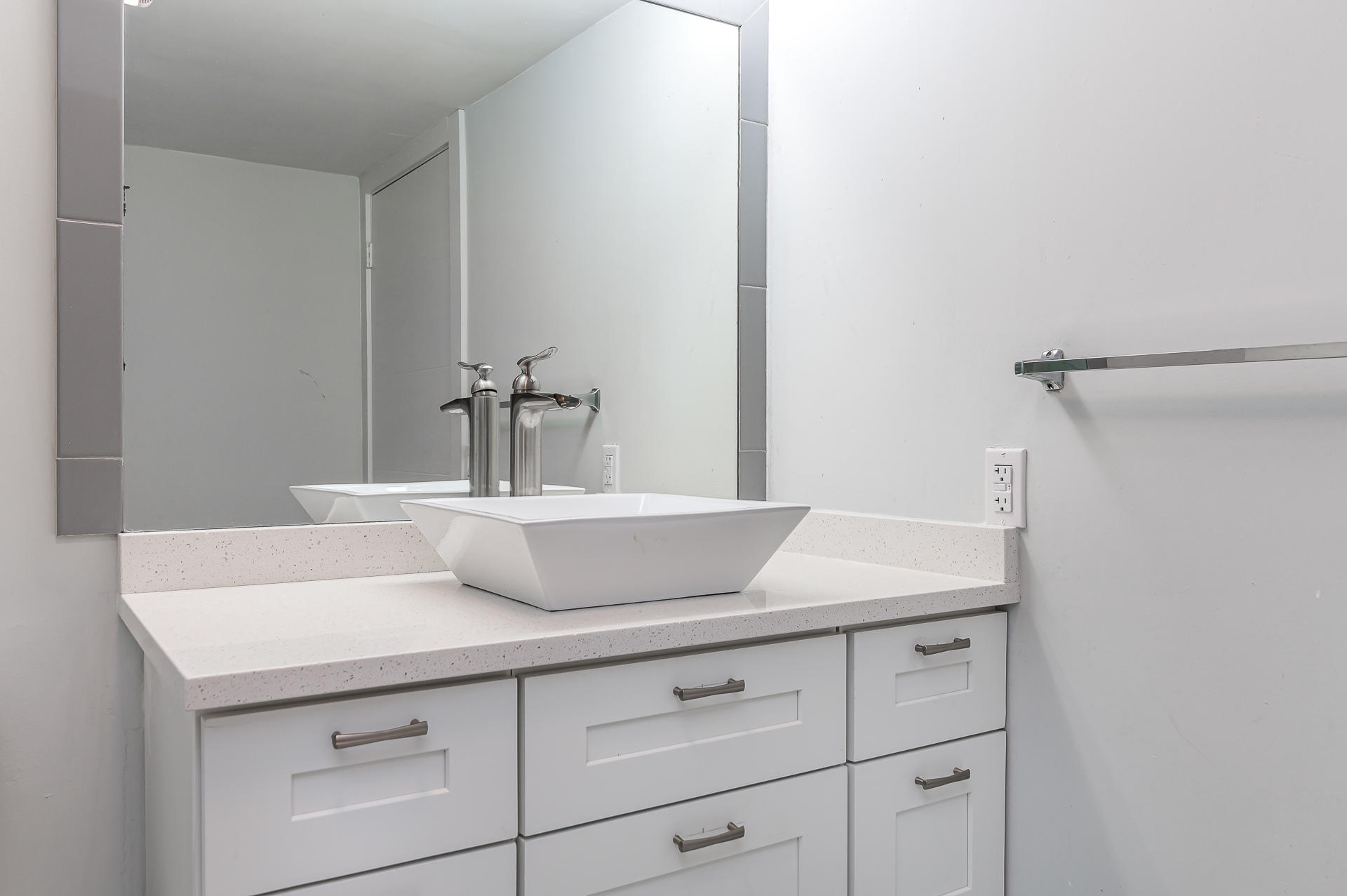 21856 Arriba Real, Unit 5E Boca Raton, FL 33433 - Photo 15 of 17 a bathroom with a sink and a mirror