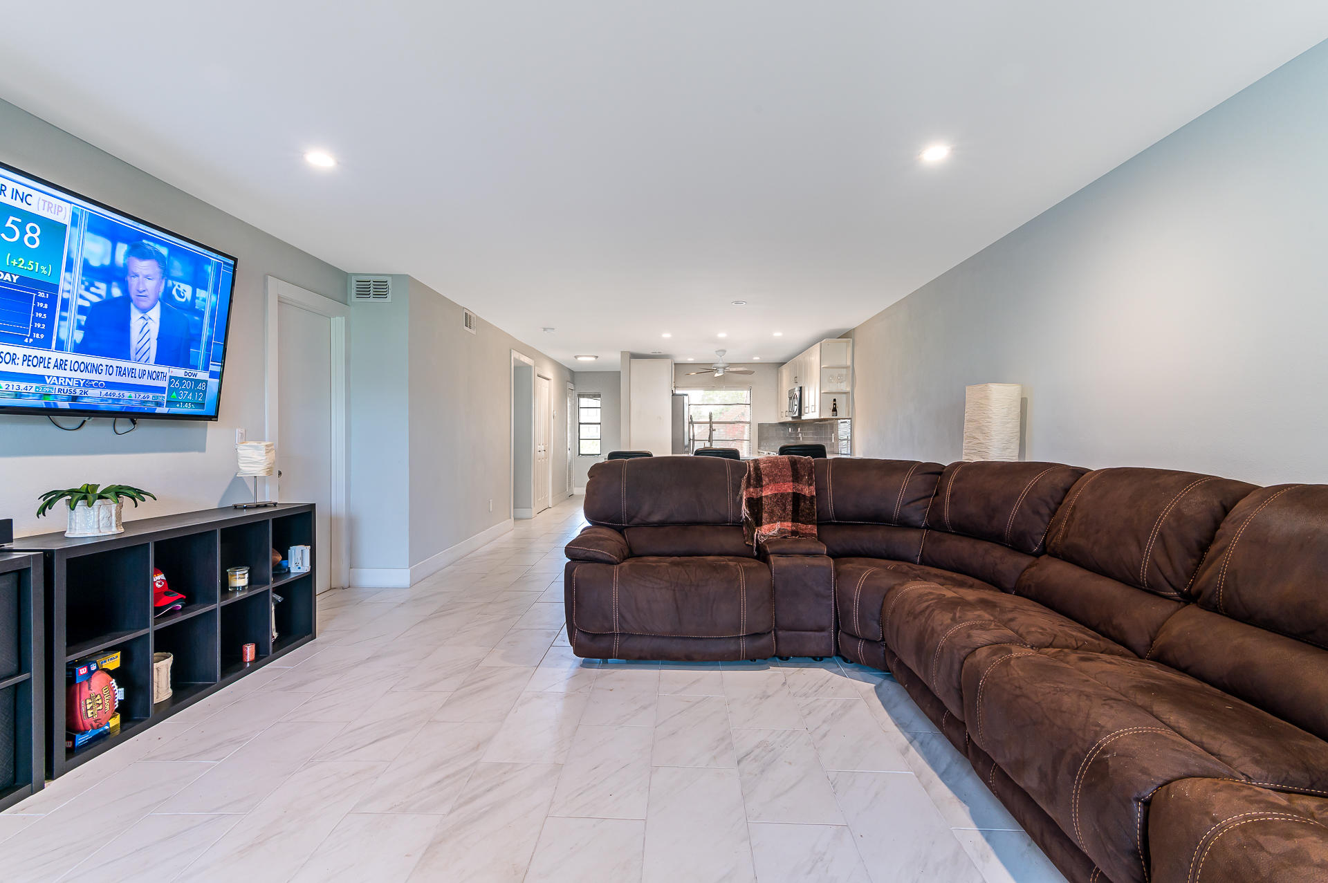 21856 Arriba Real, Unit 5E Boca Raton, FL 33433 - Photo 8 of 17 a living room with furniture and a book shelf