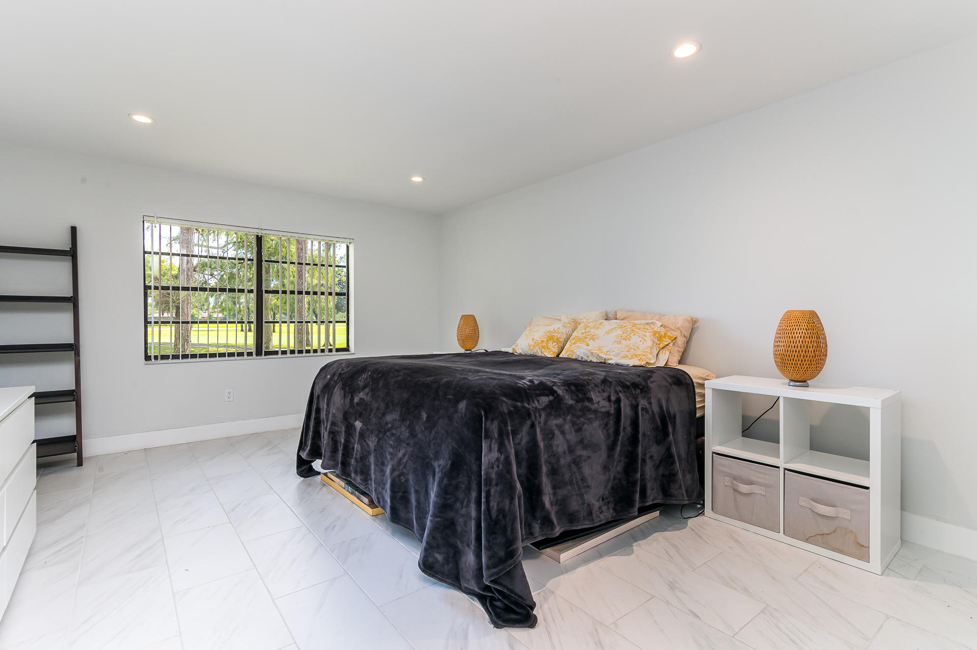 21856 Arriba Real, Unit 5E Boca Raton, FL 33433 - Photo 10 of 17 a spacious bedroom with a bed and window