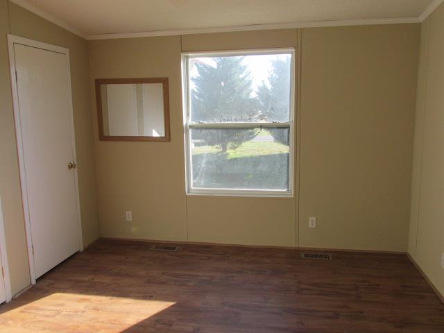 1660 Goforth Road Morrison, TN 37357 - Photo 6 of 11 an empty room with wooden floor and windows