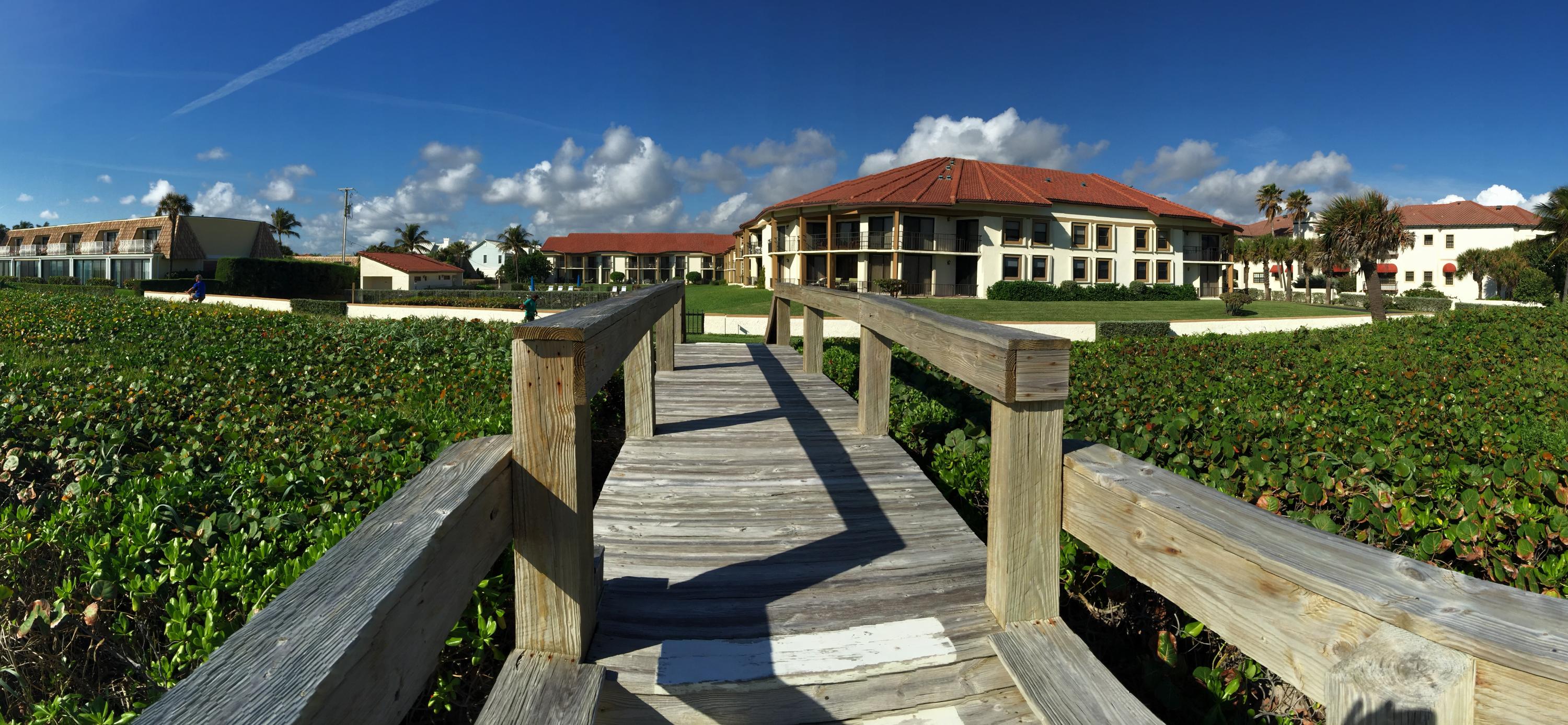 5801 North Ocean Boulevard, Unit 106 Ocean Ridge, FL 33435 - Photo 16 of 16 Oceanwalk 106 updated beach and bldg.jpg