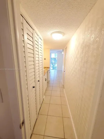 a bathroom with a shower and a sink
