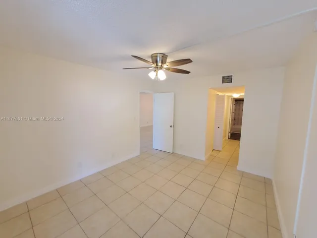 a bathroom with a toilet and a mirror